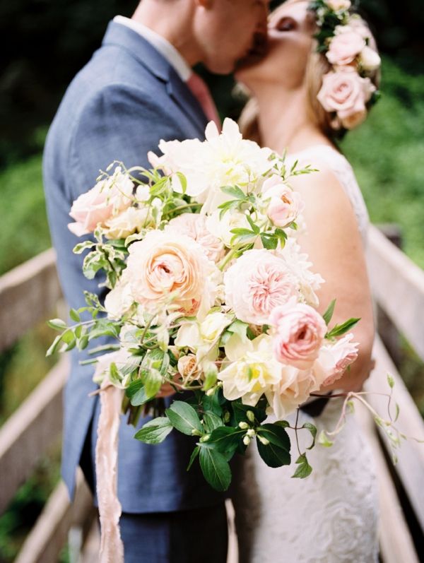 Spring adventure elopement at Wahclella Falls with pink, peach and white wedding...