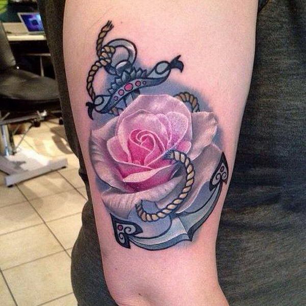 Beautiful anchor tattoo with a rose embedded into it. The anchor is seen to be e...