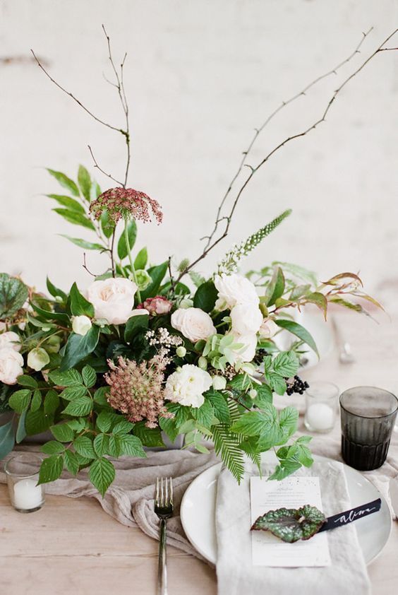 Earthy table setting with foraged wild flower arrangements // Organic contempora...