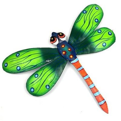 This eleven inch dragonfly is handmade in Haiti from recycled oil drums. It has ...