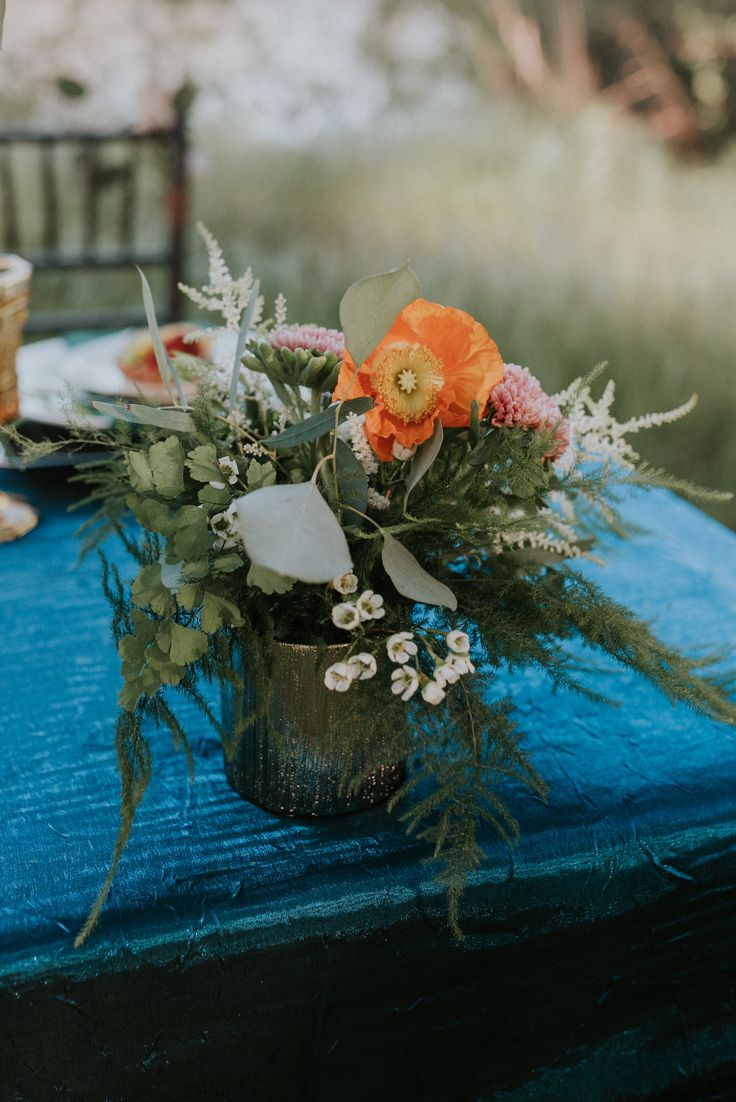 poppy and greenery wedding centerpiece
