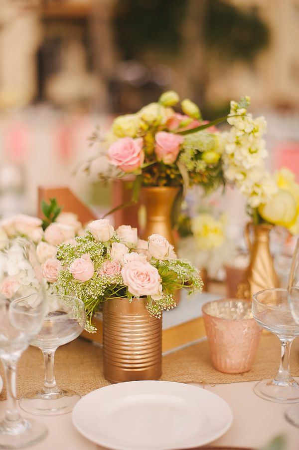 easy centerpiece idea- spray paint cans gold and fill with pretty flowers www.we...